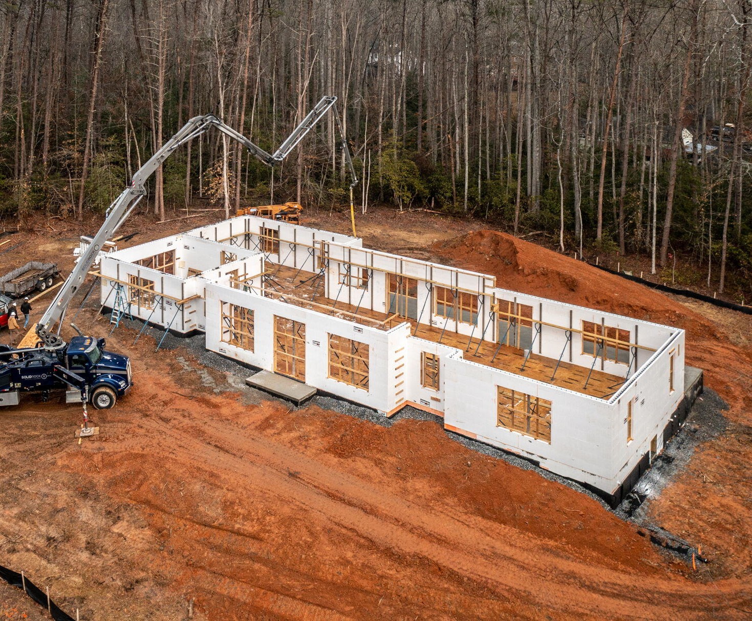 Overhead view of ICF construction with a pump truck loaded with concrete in view ready to fill the walls